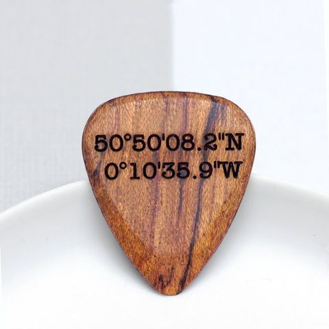 wooden guitar plectrum with coordinates