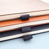 Three notebooks with pen holder slots
