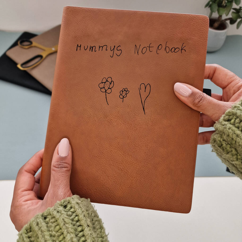 Brown notebook with child's handwriting and drawing