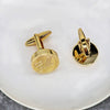 gold cufflinks engraved with script font