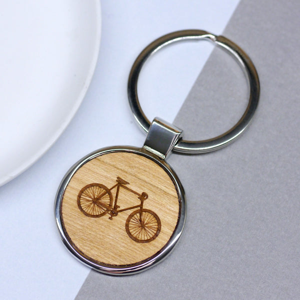 Wooden keyring with bike illustration