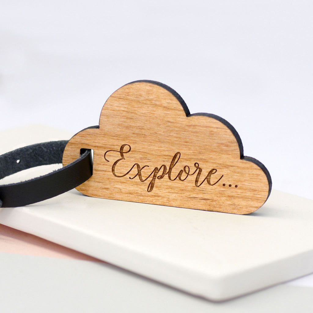 Explore calligraphy text on wooden cloud luggage tag