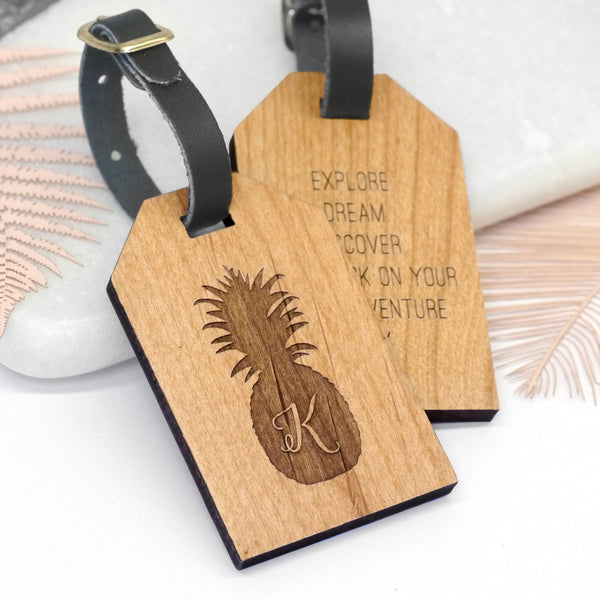 Wooden luggage tag personalised with initial and pineapple
